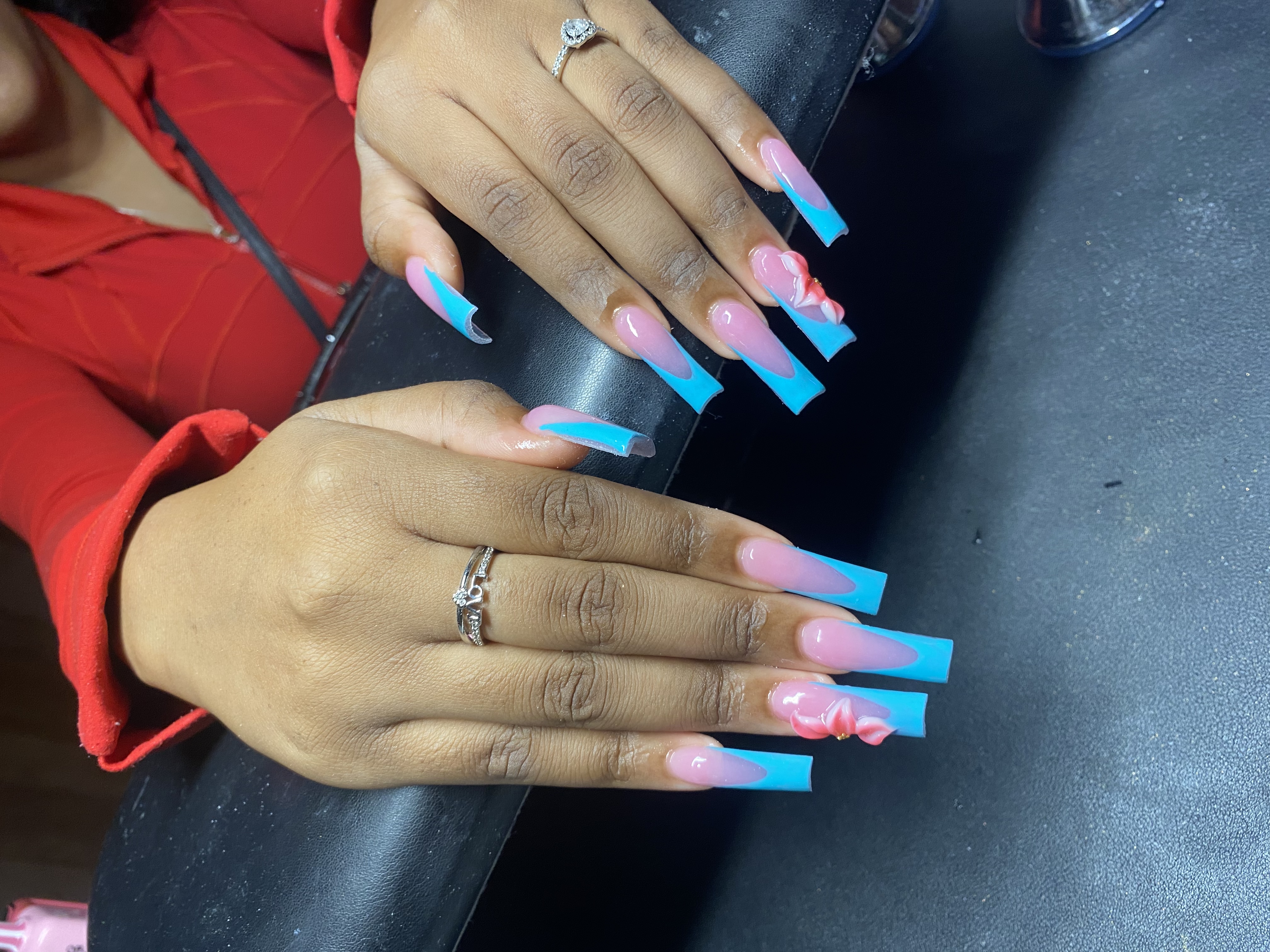 Long blue French tip coffin nails with 3D rose