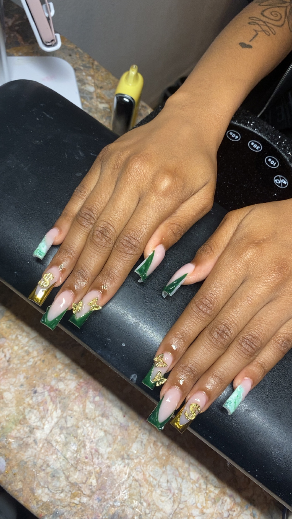 Green and gold coffin nails with money sign and butterflies